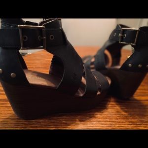 Black CAT wedge heels.